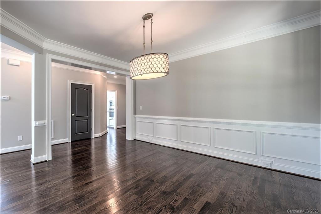 133 Overlook Ridge Lane Davidson, NC 28036 - Photo 8 of 35 a view of empty room with wooden floor and ceiling fan