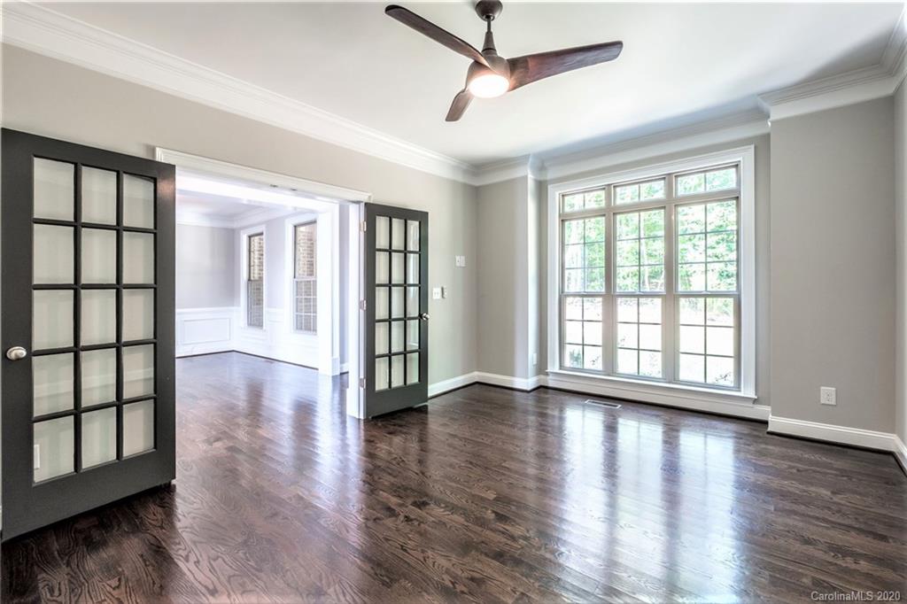 133 Overlook Ridge Lane Davidson, NC 28036 - Photo 9 of 35 a view of an empty room with wooden floor and a window