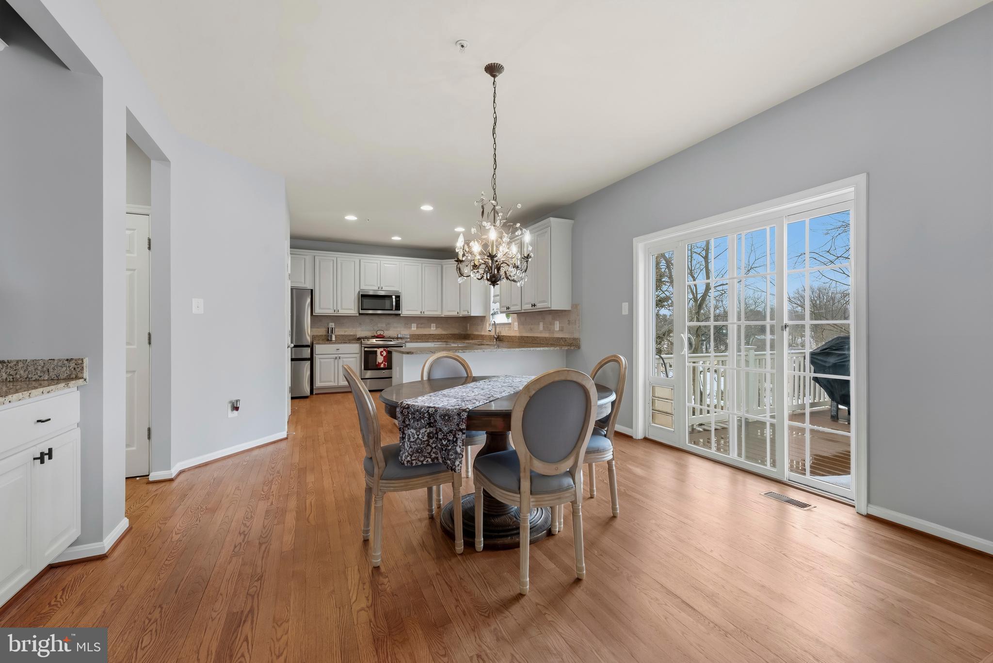 3007 Bender Ridge Court Baltimore, MD 21234 - Photo 12 of 39 a view of a dining room with furniture window and wooden floor