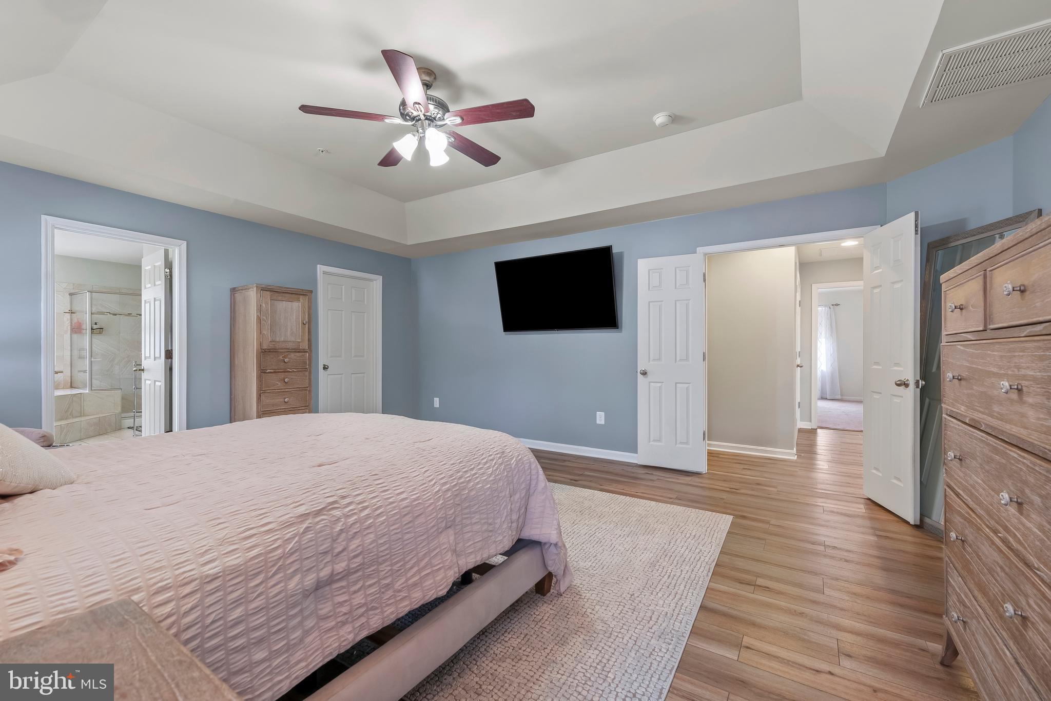 3007 Bender Ridge Court Baltimore, MD 21234 - Photo 17 of 39 a bedroom with a bed and a flat screen tv