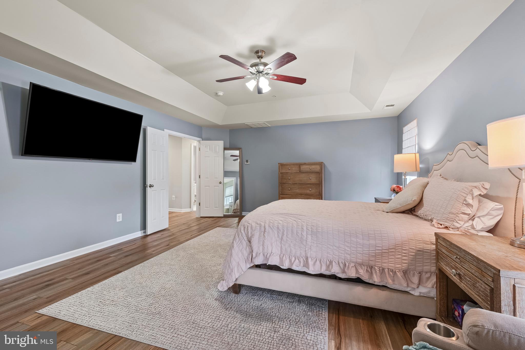 3007 Bender Ridge Court Baltimore, MD 21234 - Photo 18 of 39 a bedroom with a large bed and a flat screen tv
