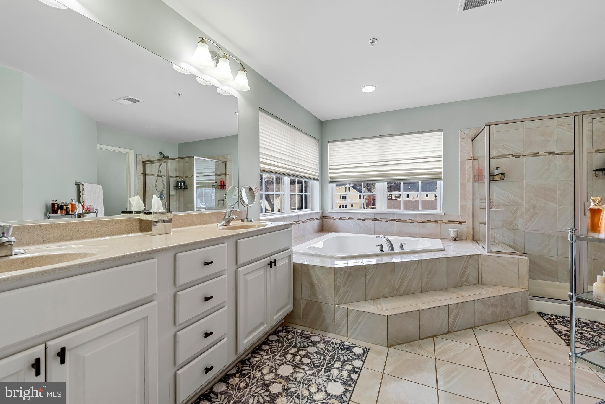3007 Bender Ridge Court Baltimore, MD 21234 - Photo 19 of 39 a spacious bathroom with a tub sink and mirror