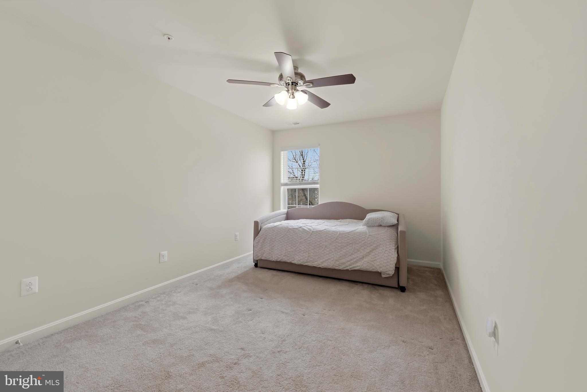 3007 Bender Ridge Court Baltimore, MD 21234 - Photo 21 of 39 a spacious bedroom with a bed and a ceiling fan