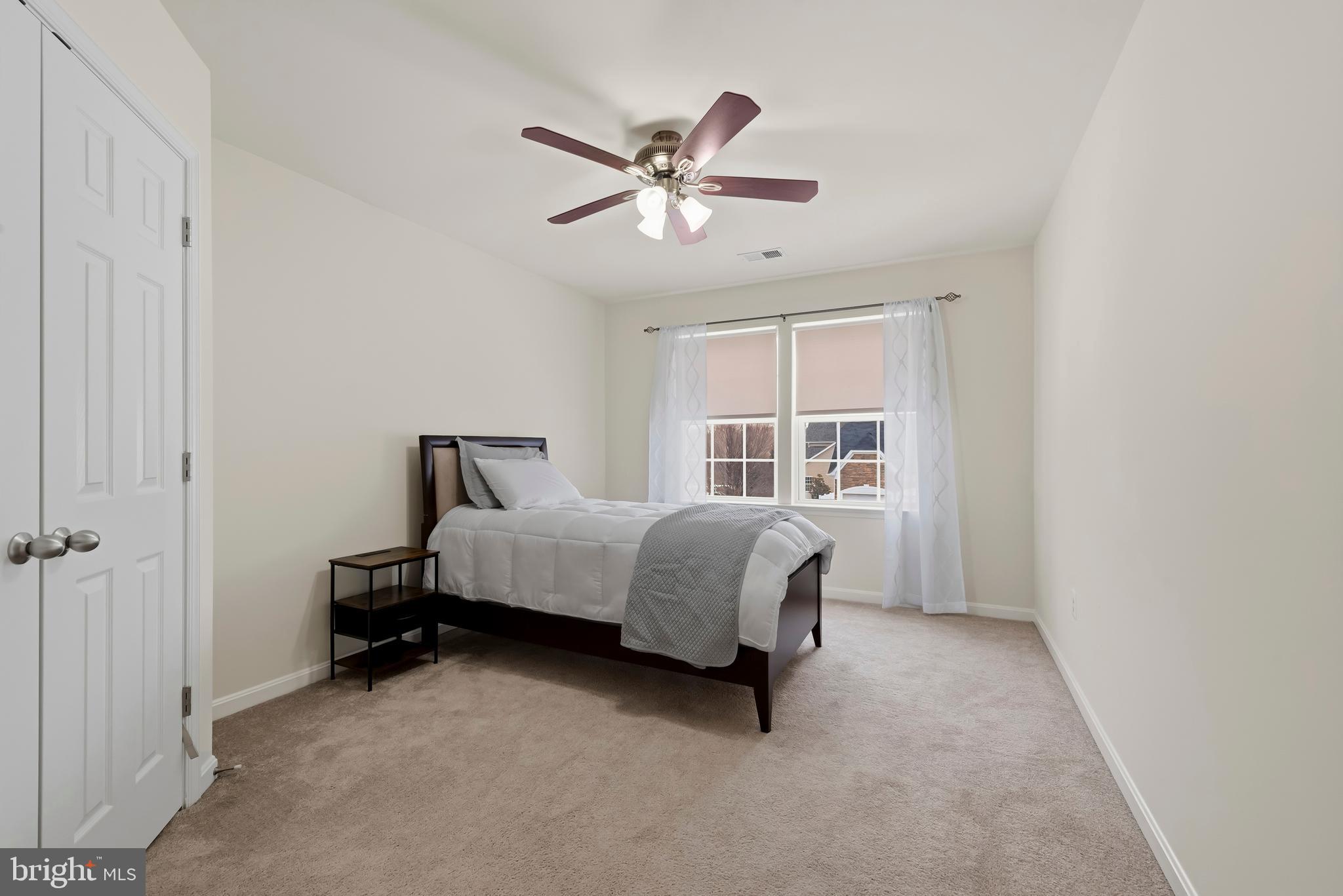 3007 Bender Ridge Court Baltimore, MD 21234 - Photo 23 of 39 a bedroom with a bed and window