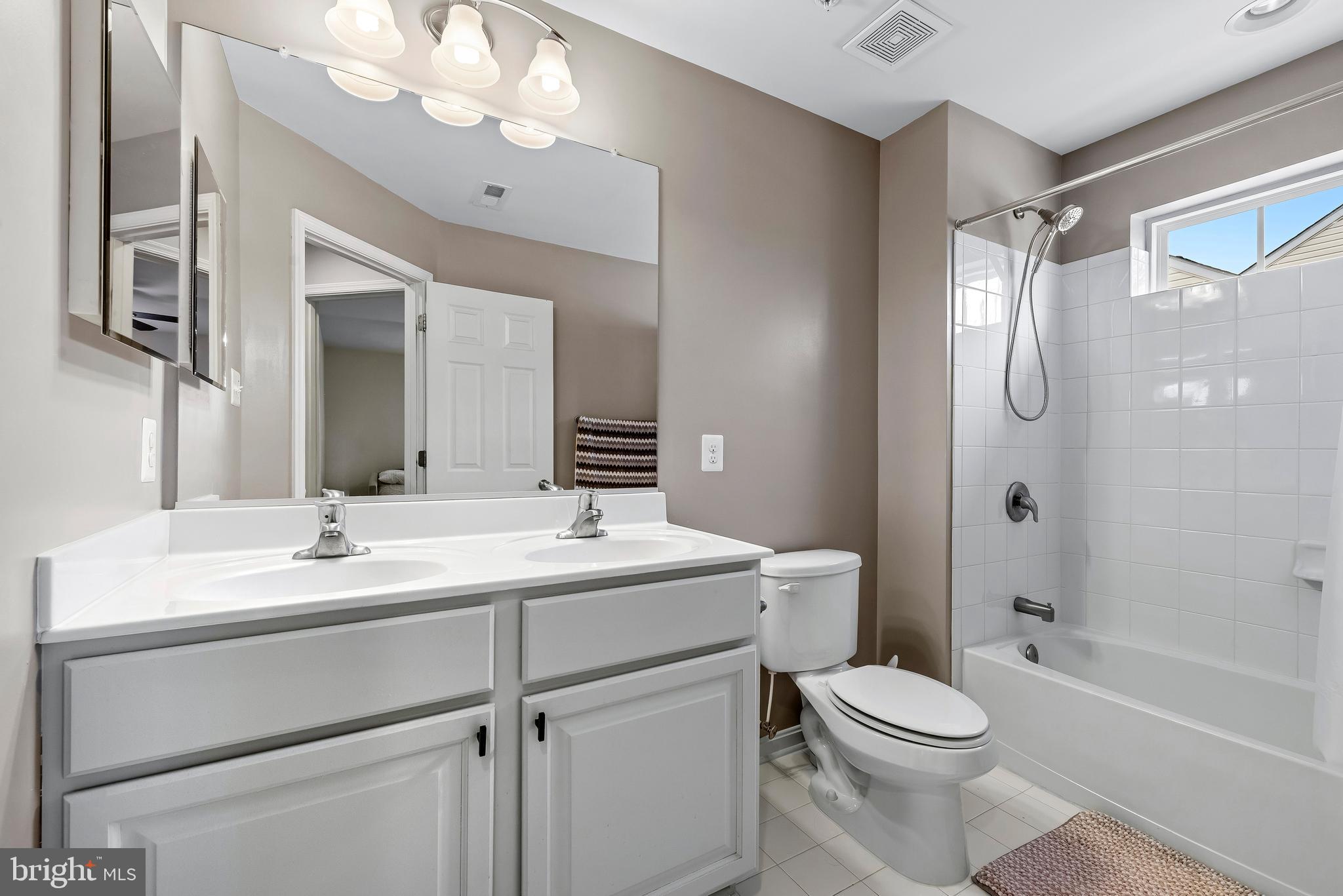 3007 Bender Ridge Court Baltimore, MD 21234 - Photo 26 of 39 a bathroom with a sink toilet vanity and shower