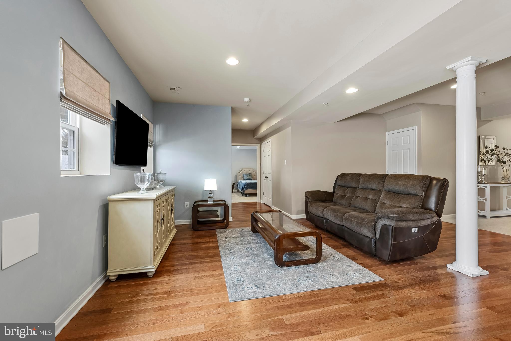 3007 Bender Ridge Court Baltimore, MD 21234 - Photo 29 of 39 a living room with furniture and a flat screen tv