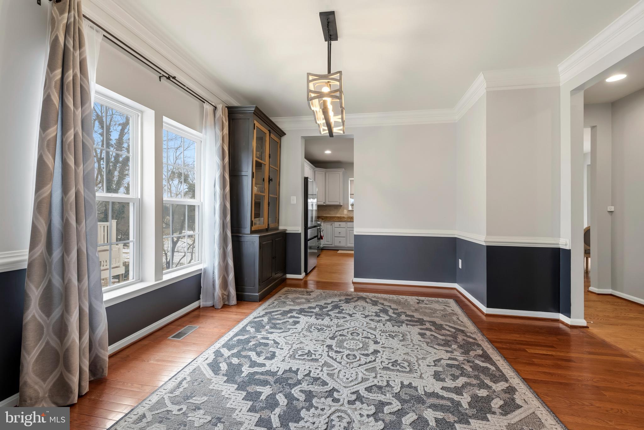 3007 Bender Ridge Court Baltimore, MD 21234 - Photo 5 of 39 a view of a hallway to an empty room with wooden floor and windows