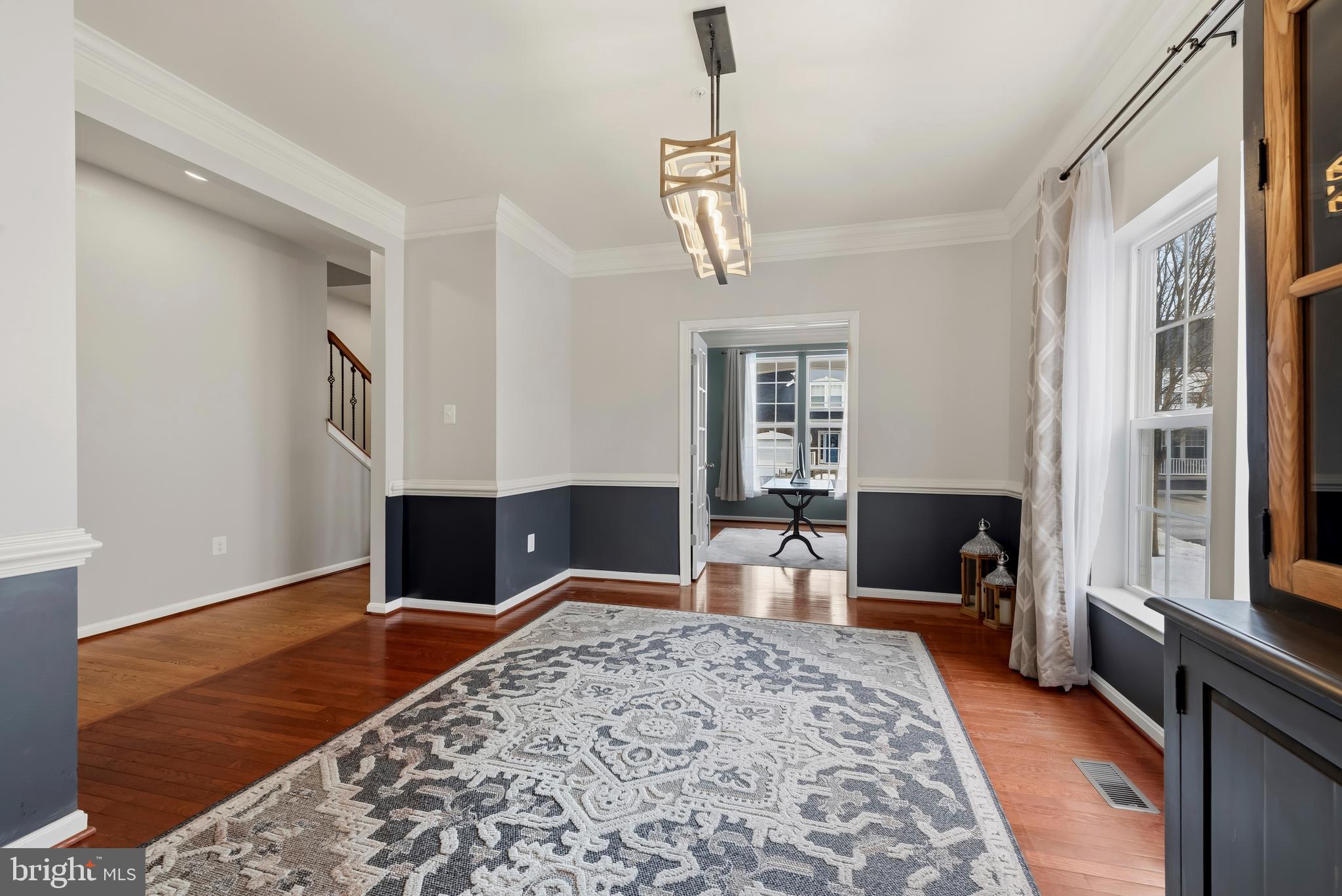 3007 Bender Ridge Court Baltimore, MD 21234 - Photo 6 of 39 a bedroom with a bed and wooden floor