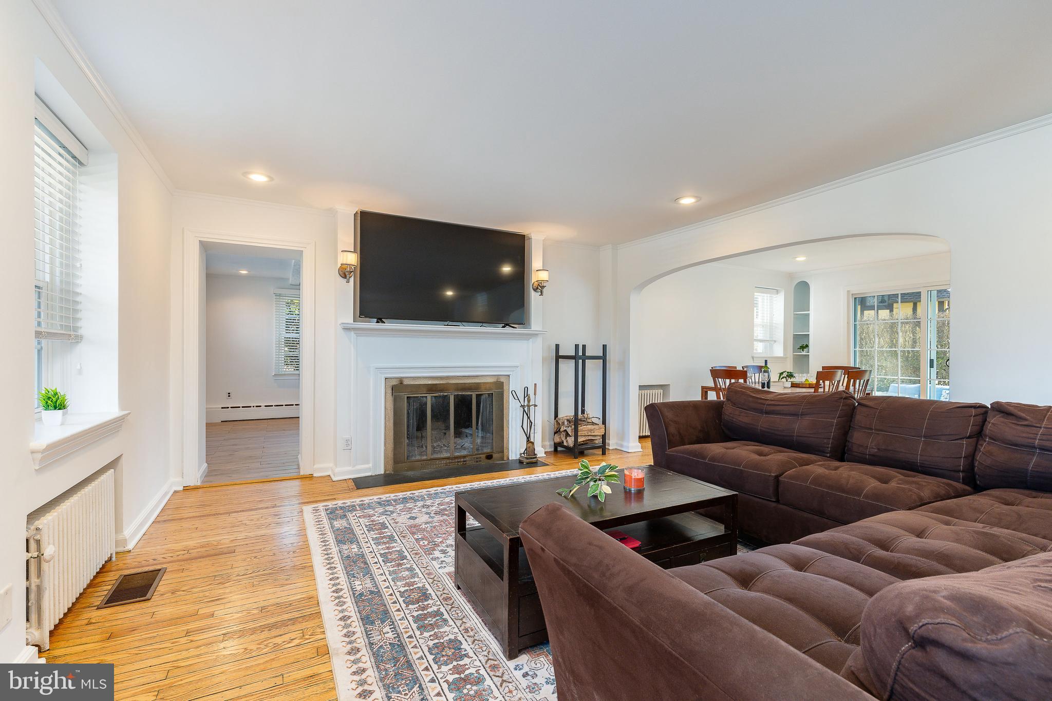 1208 Andover Road Wynnewood, PA 19096 - Photo 11 of 31 a living room with furniture and a fireplace
