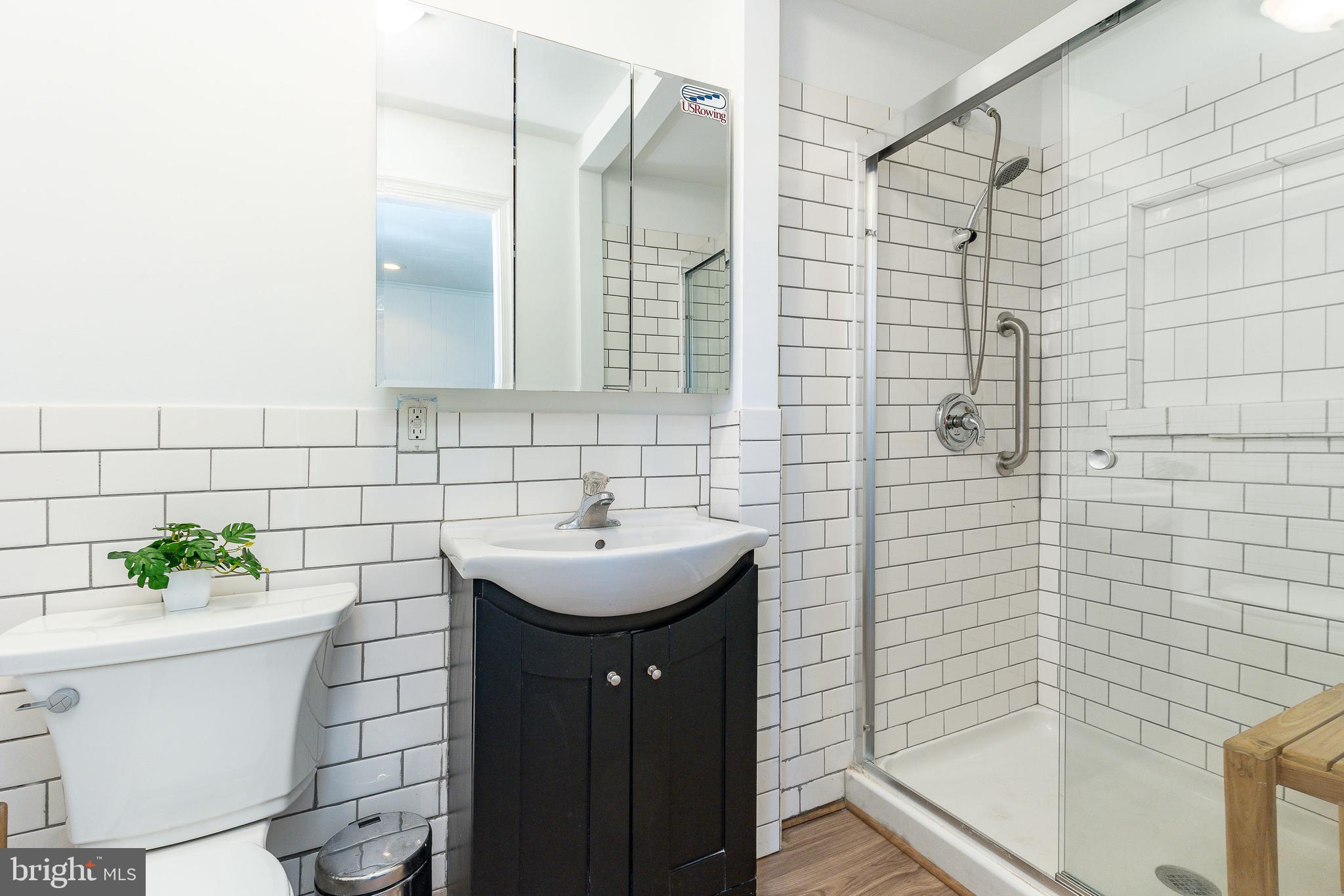 1208 Andover Road Wynnewood, PA 19096 - Photo 16 of 31 a bathroom with a sink a toilet and shower