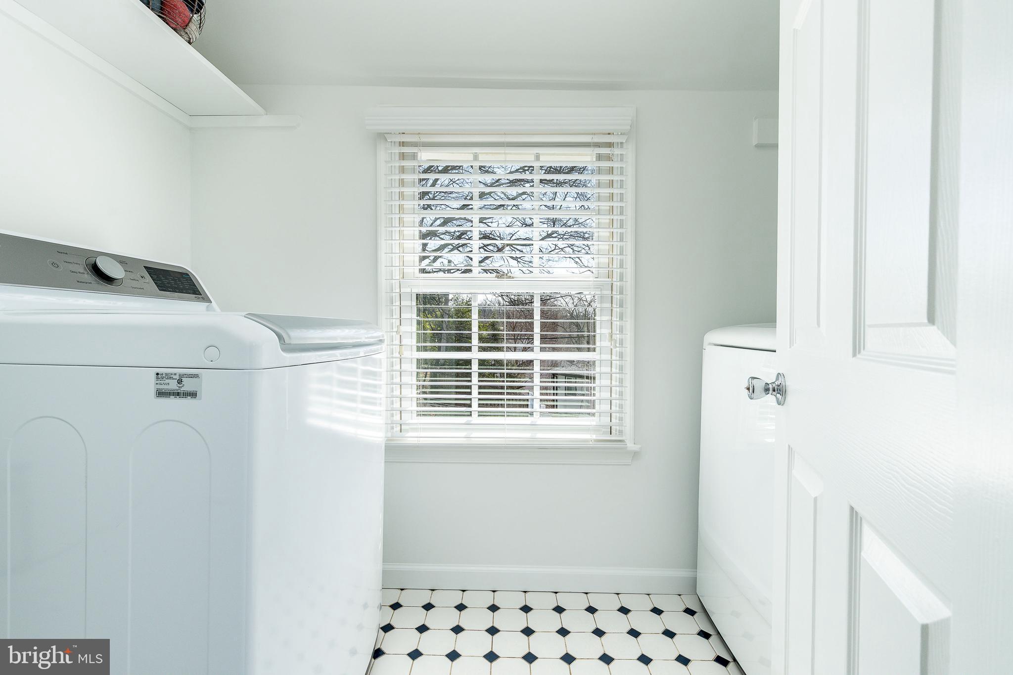 1208 Andover Road Wynnewood, PA 19096 - Photo 18 of 31 a bathroom with a window and a white cabinet