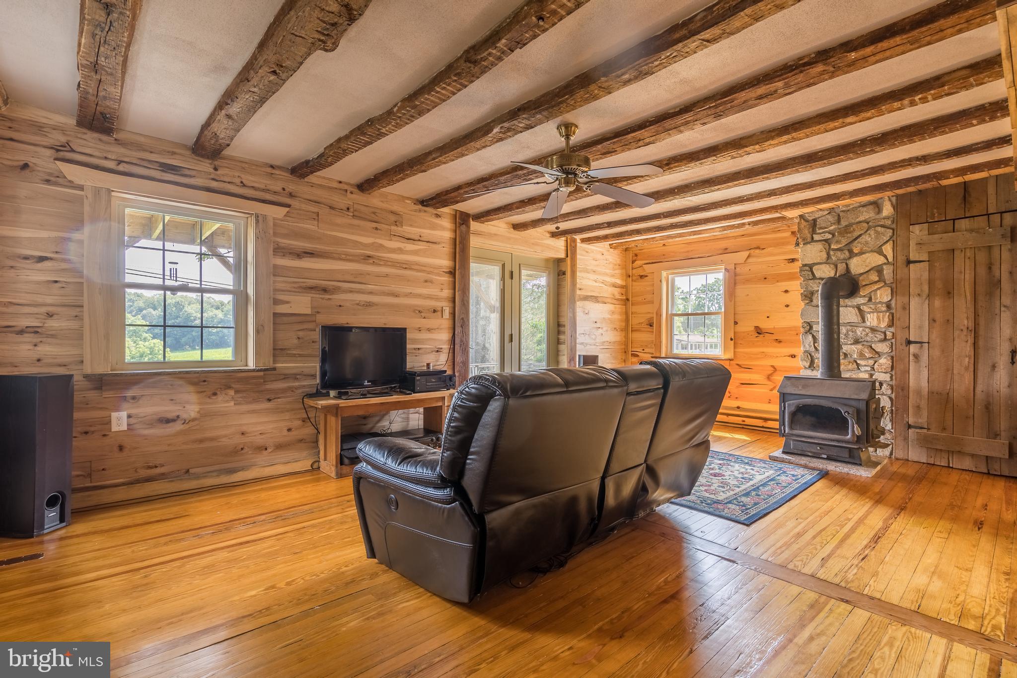 3812 Beckleysville Road Hampstead, MD 21074 - Photo 4 of 31 Large living room with wood stove