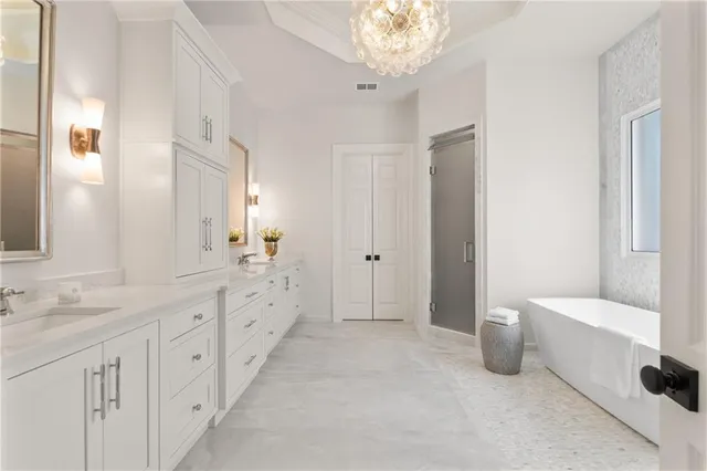 a bathroom with a tub and shower