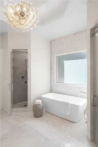 a en suite bathroom with double sink and a mirror