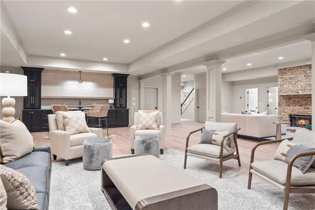 a kitchen with stainless steel appliances granite countertop a sink and wooden cabinets