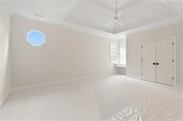 a bathroom with a granite countertop sink a toilet and a bathtub