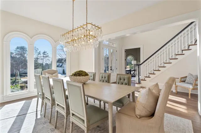a view of a dining room with furniture window and wooden floor