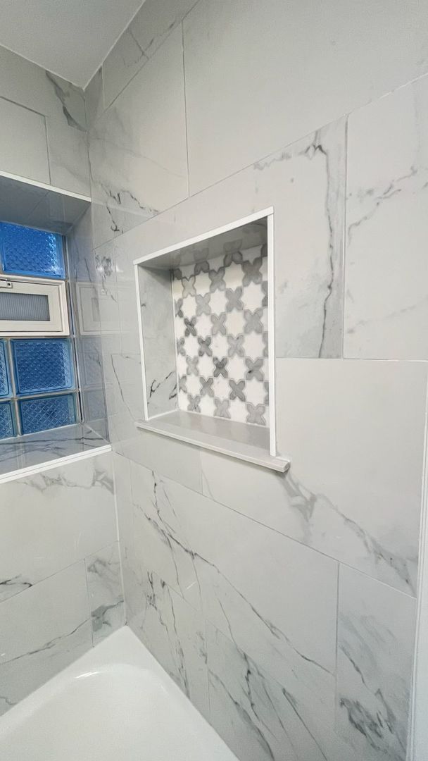 1201 South 15th Avenue Maywood, IL 60153 - Photo 24 of 28 a bathroom with a bathtub and shower