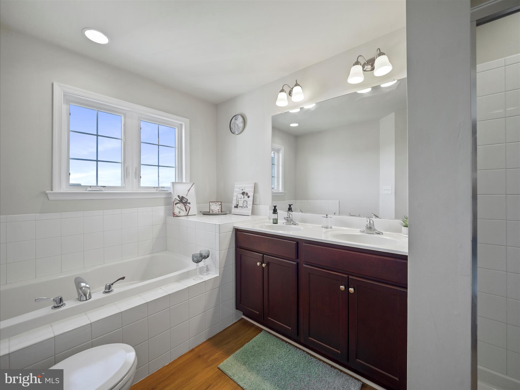 1142 Stallion Street Ranson, WV 25438 - Photo 24 of 31 a spacious bathroom with a tub double sink window and mirror