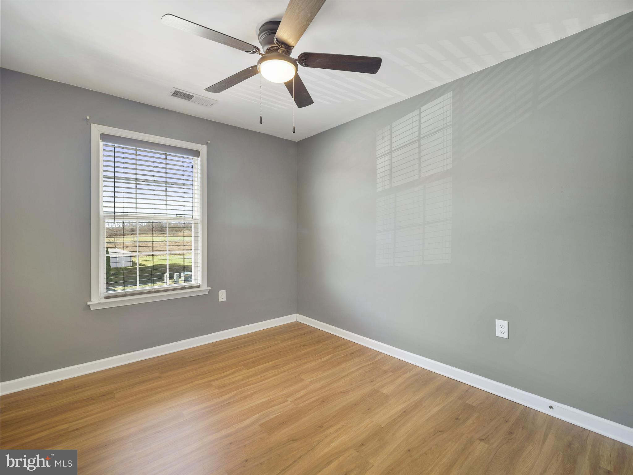 1142 Stallion Street Ranson, WV 25438 - Photo 25 of 31 an empty room with a window and a ceiling fan