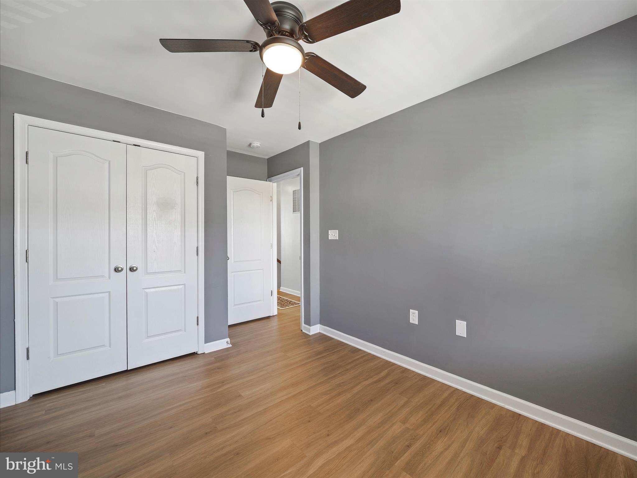 1142 Stallion Street Ranson, WV 25438 - Photo 26 of 31 an empty room with wooden floor a ceiling fan and closet