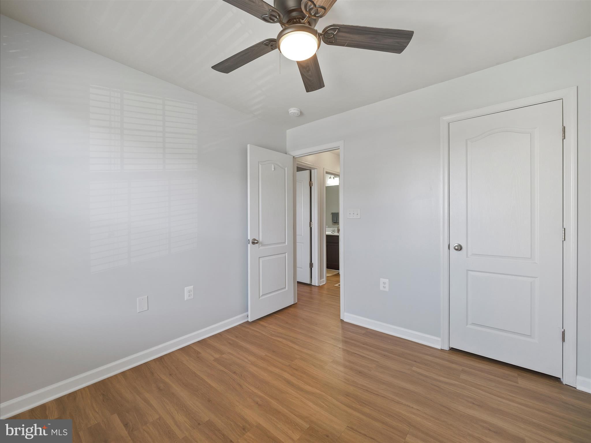 1142 Stallion Street Ranson, WV 25438 - Photo 28 of 31 an empty room with wooden floor a ceiling fan and closet
