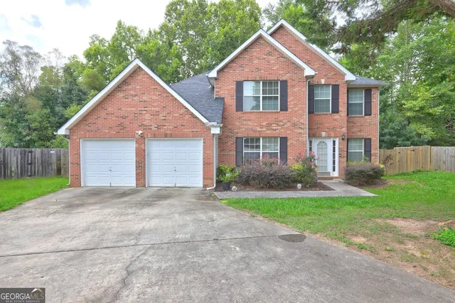 front view of a house and a yard