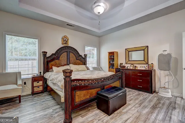 a bed room with a bed and a dresser