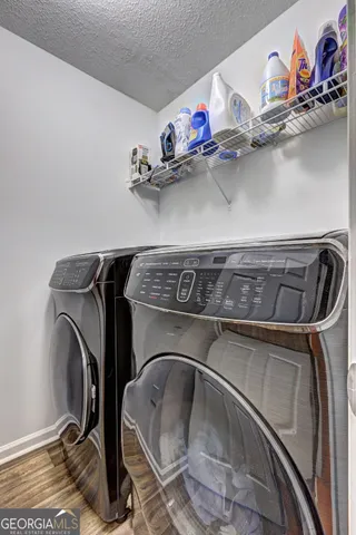 a view of a kitchen with sink and dishwasher