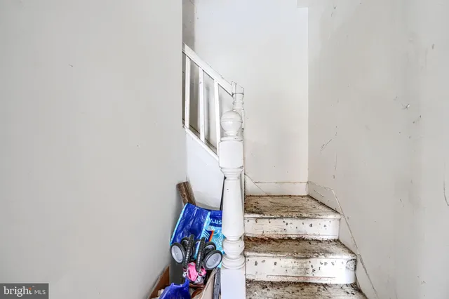 a bedroom with bed and a window