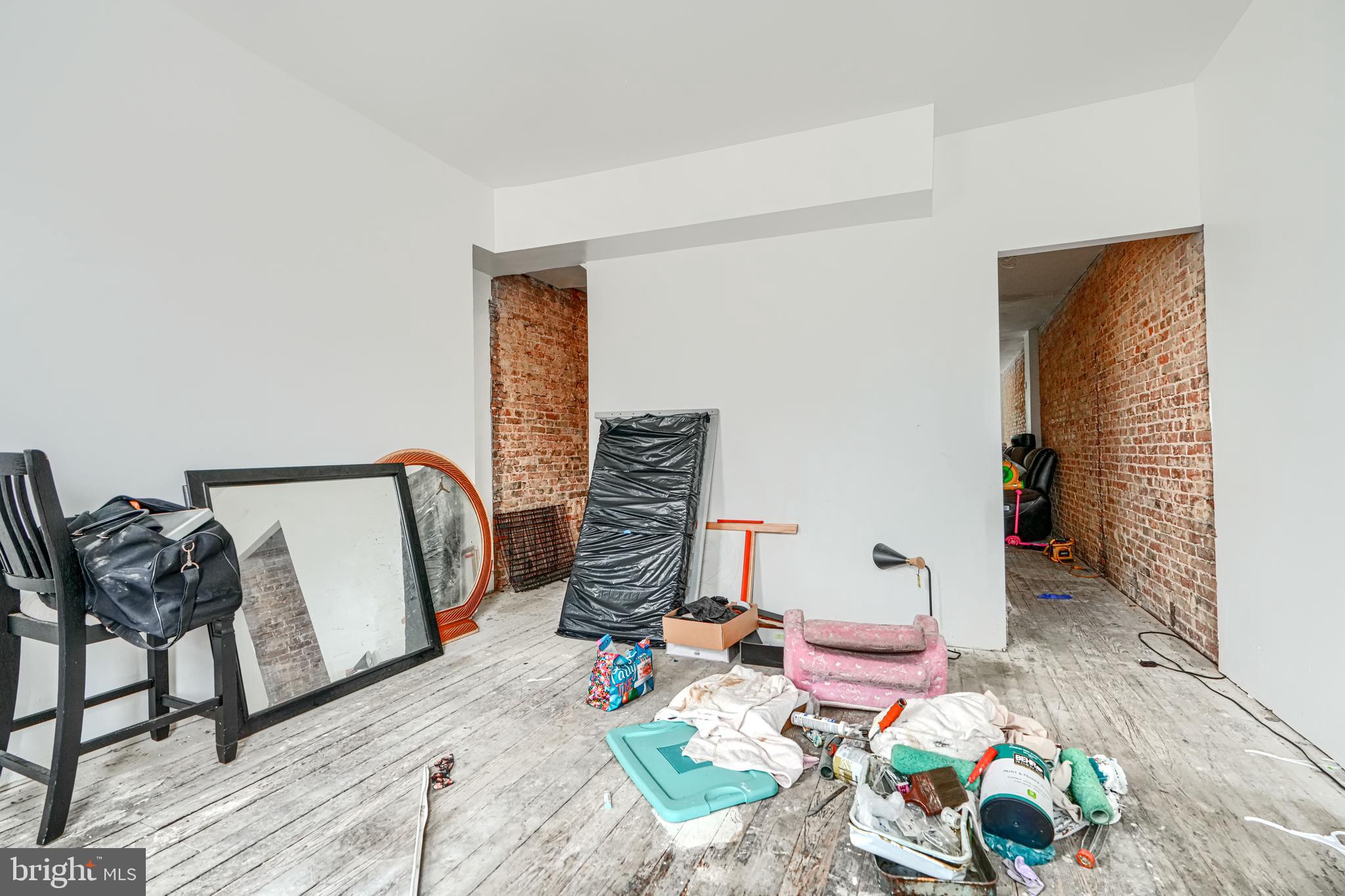1312 Aisquith Street Baltimore, MD 21202 - Photo 13 of 25 a living room with furniture and wooden floor