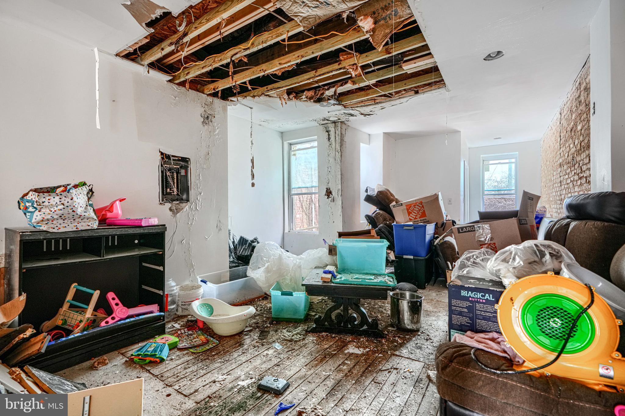 1312 Aisquith Street Baltimore, MD 21202 - Photo 15 of 25 a living room with furniture and a wooden floor