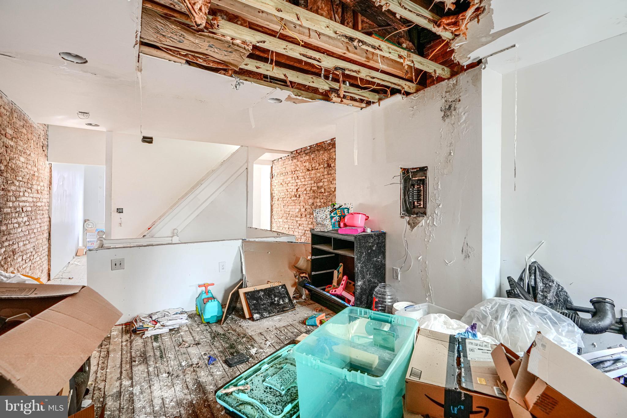 1312 Aisquith Street Baltimore, MD 21202 - Photo 16 of 25 a bed room with a bed and a table