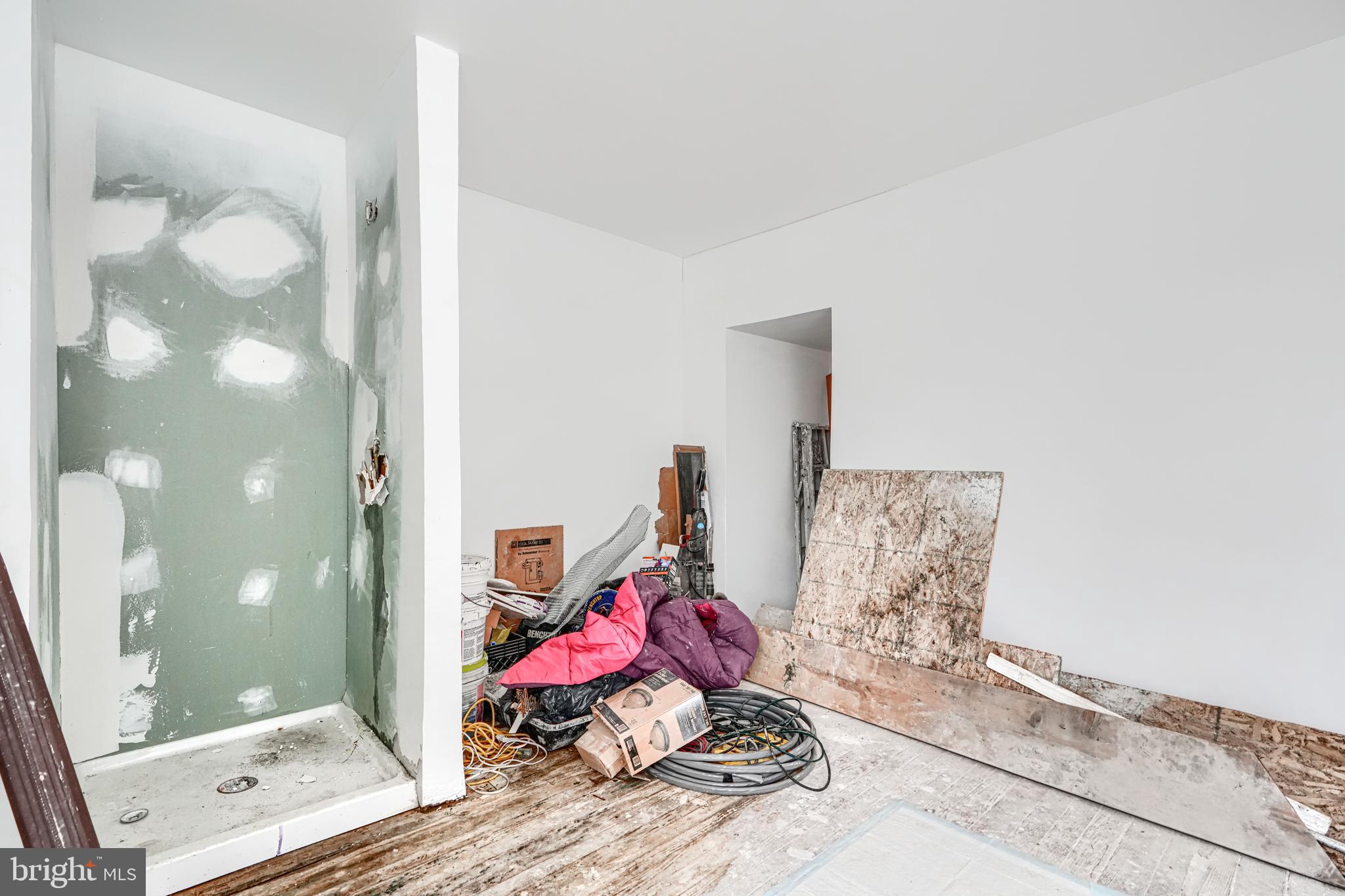 1312 Aisquith Street Baltimore, MD 21202 - Photo 18 of 25 a living room with furniture and a gate