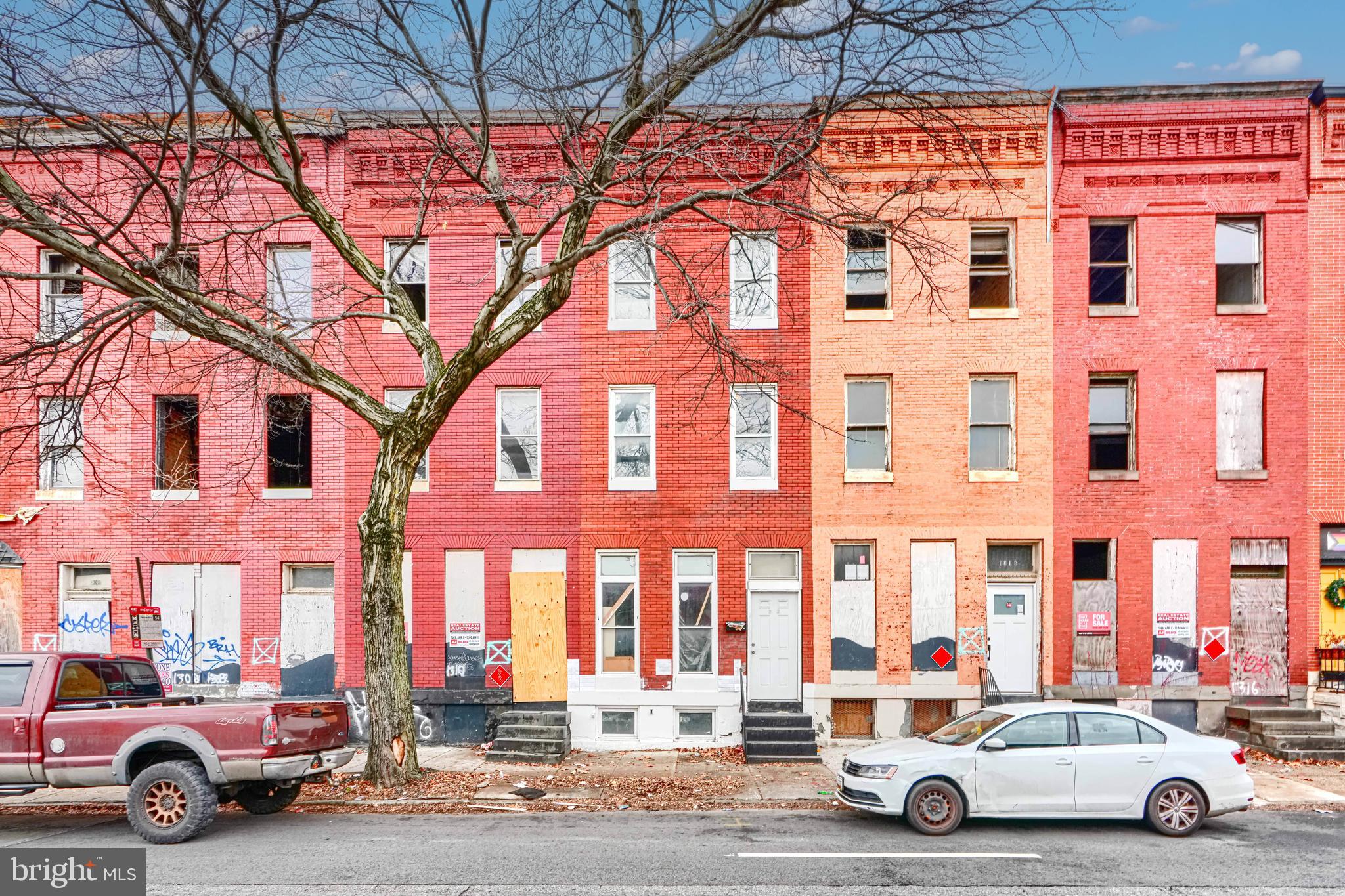 1312 Aisquith Street Baltimore, MD 21202 - Photo 3 of 25 a car parked in front of a building