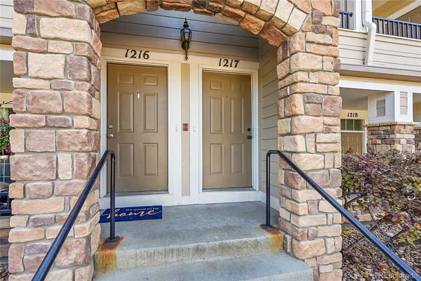 a front view of a house with stairs