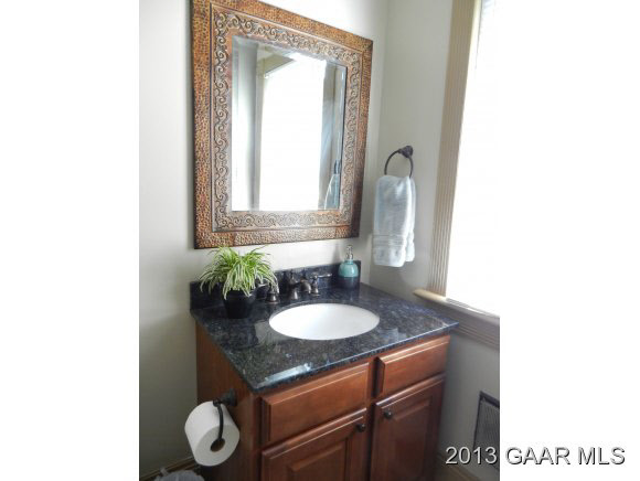 48 Buttermilk Road Mount Sidney, VA 24467 - Photo 17 of 24 a bathroom with a granite countertop sink and a mirror