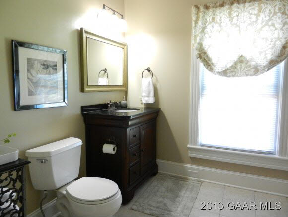 48 Buttermilk Road Mount Sidney, VA 24467 - Photo 20 of 24 a bathroom with a toilet a sink and a mirror