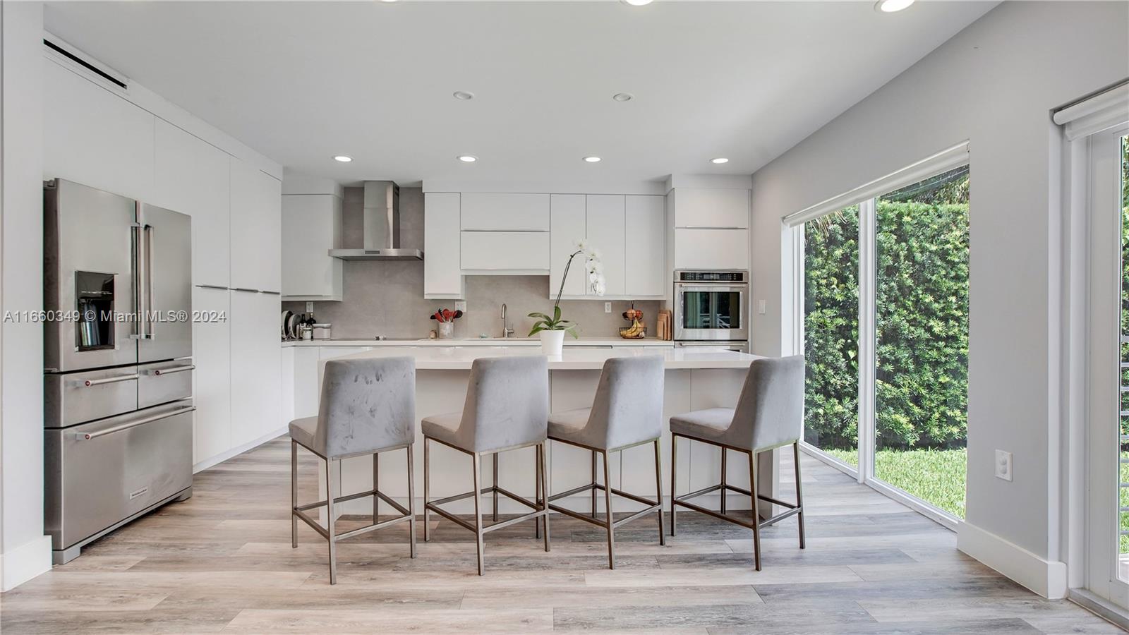 3601 Southwest 58th Avenue Miami, FL 33155 - Photo 1 of 19 a kitchen with stainless steel appliances granite countertop a table chairs refrigerator and sink