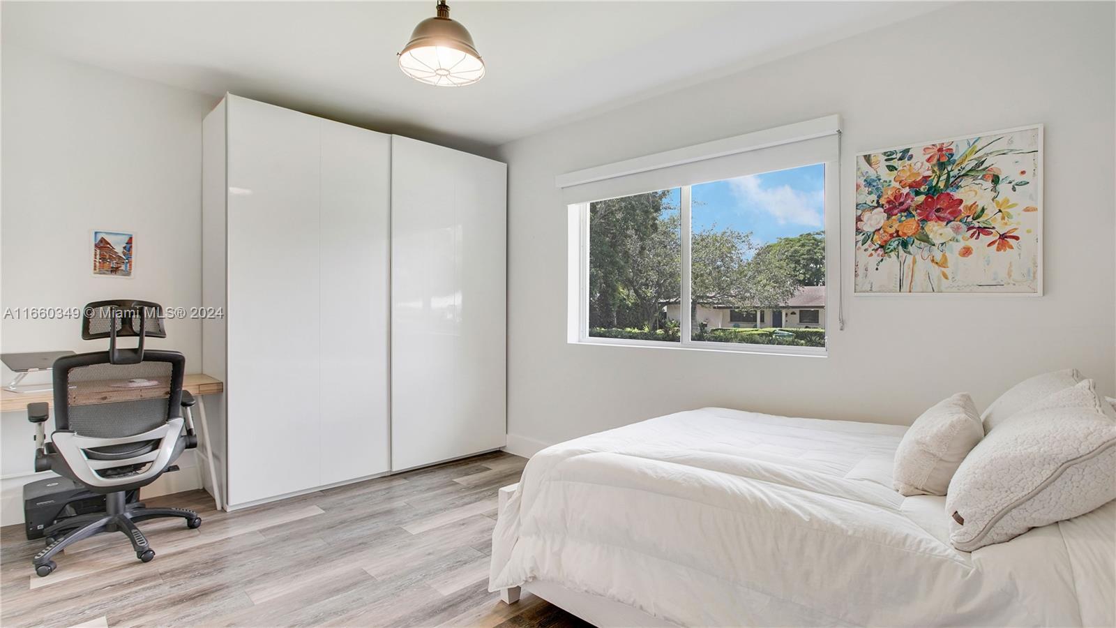 3601 Southwest 58th Avenue Miami, FL 33155 - Photo 16 of 19 a bedroom with a bed and a painting on the wall