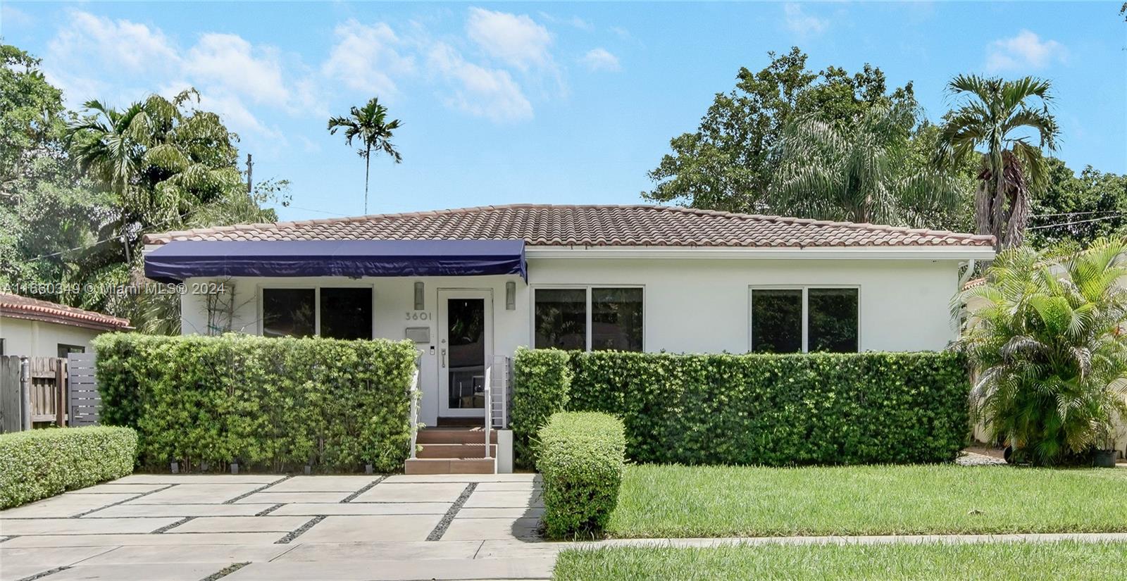 3601 Southwest 58th Avenue Miami, FL 33155 - Photo 2 of 19 a front view of a house with a yard