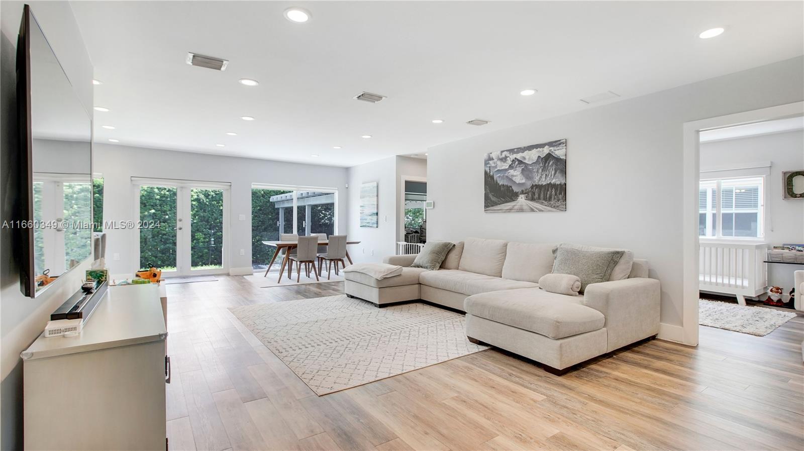 3601 Southwest 58th Avenue Miami, FL 33155 - Photo 5 of 19 a living room with furniture and a flat screen tv