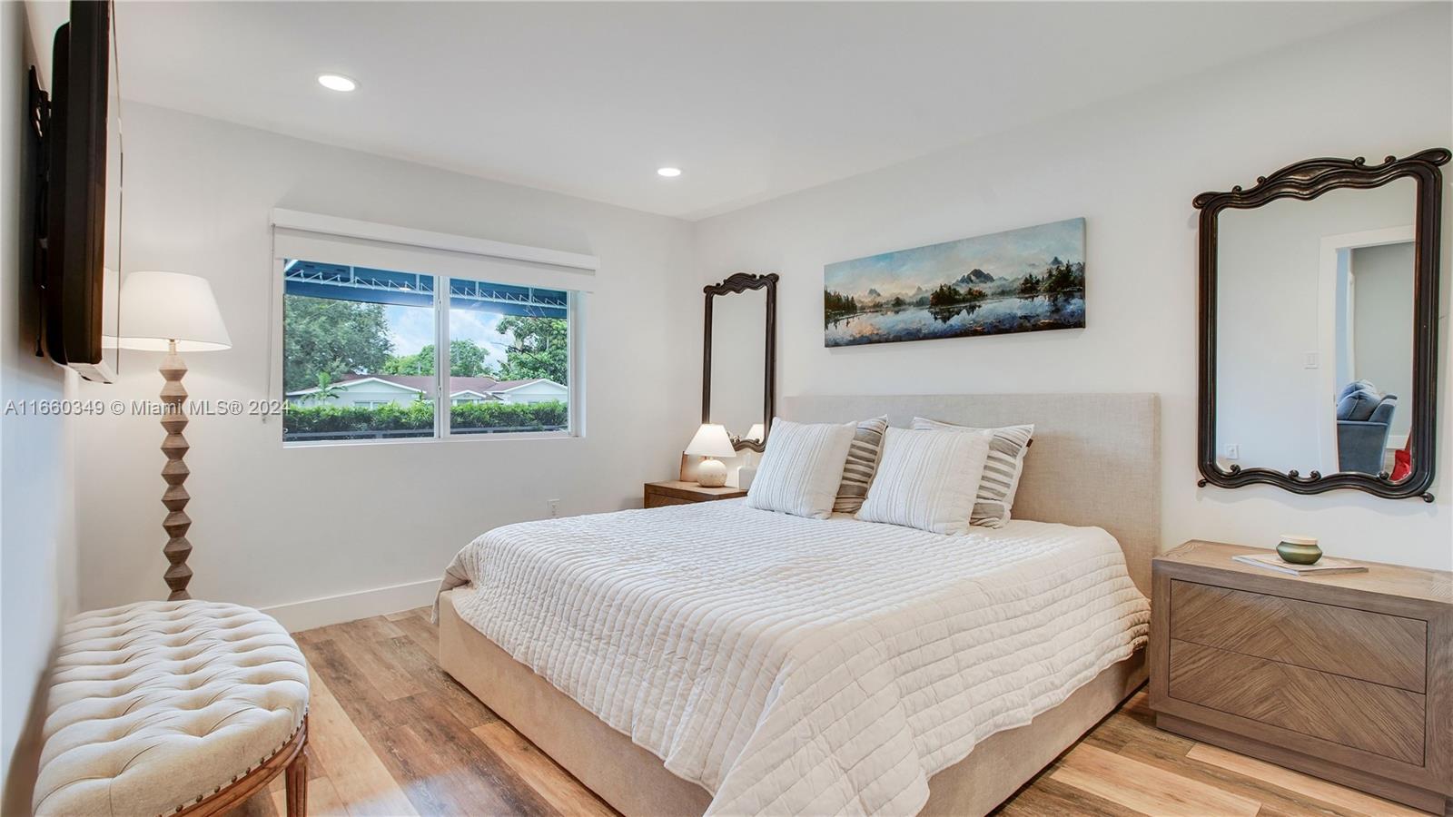 3601 Southwest 58th Avenue Miami, FL 33155 - Photo 10 of 19 a bedroom with a bed and a flat screen tv