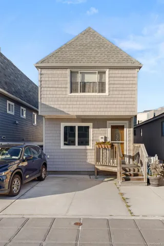 a car parked in front of a house