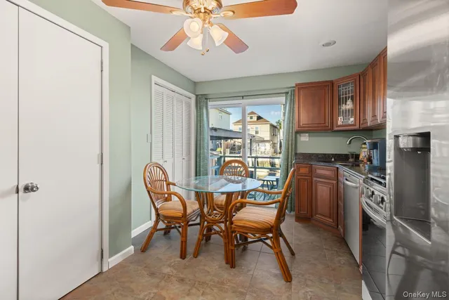 a dining room with furniture and window