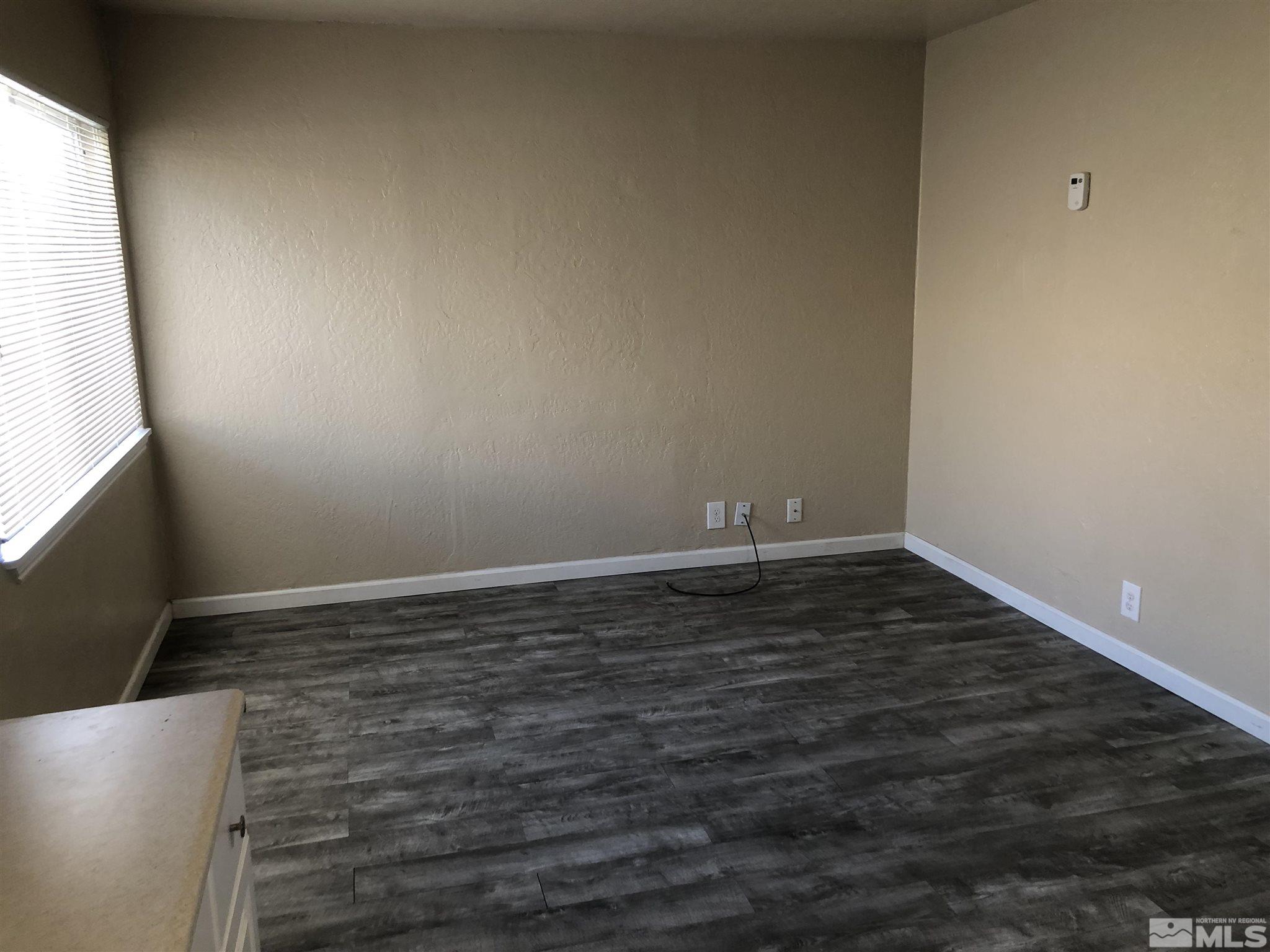 770 Montello Street Reno, NV 89512 - Photo 3 of 10 a view of a room with wooden floor and window