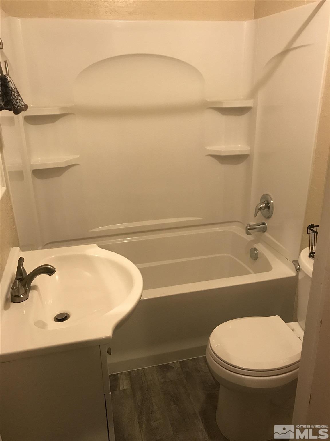 770 Montello Street Reno, NV 89512 - Photo 4 of 10 a bathroom with a sink a toilet and bathtub