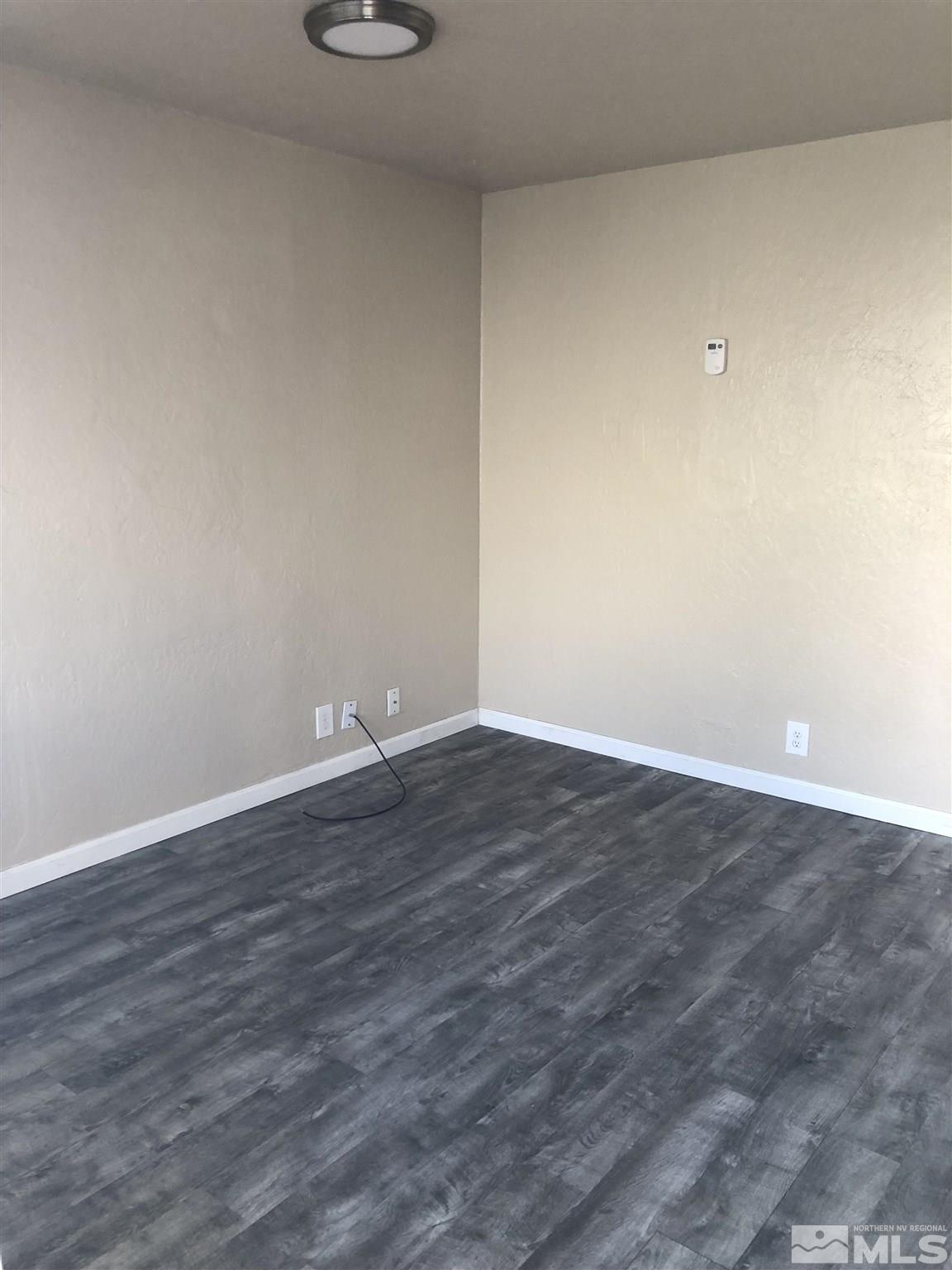 770 Montello Street Reno, NV 89512 - Photo 9 of 10 a view of an empty room with wooden floor