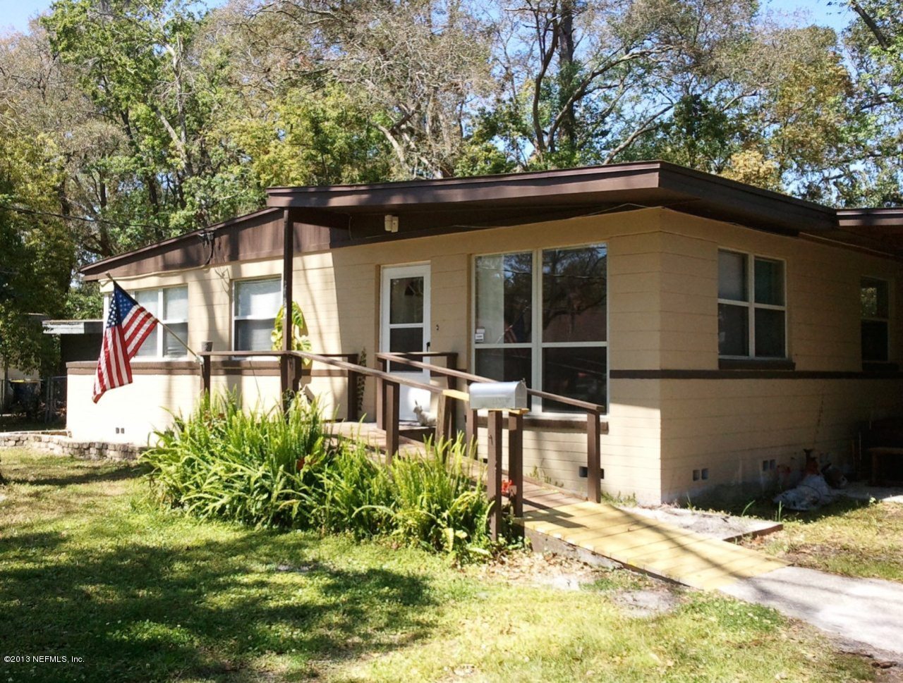 2133 Newberry Road Jacksonville, FL 32218 - Photo 1 of 29 a backyard of a house with yard and outdoor seating