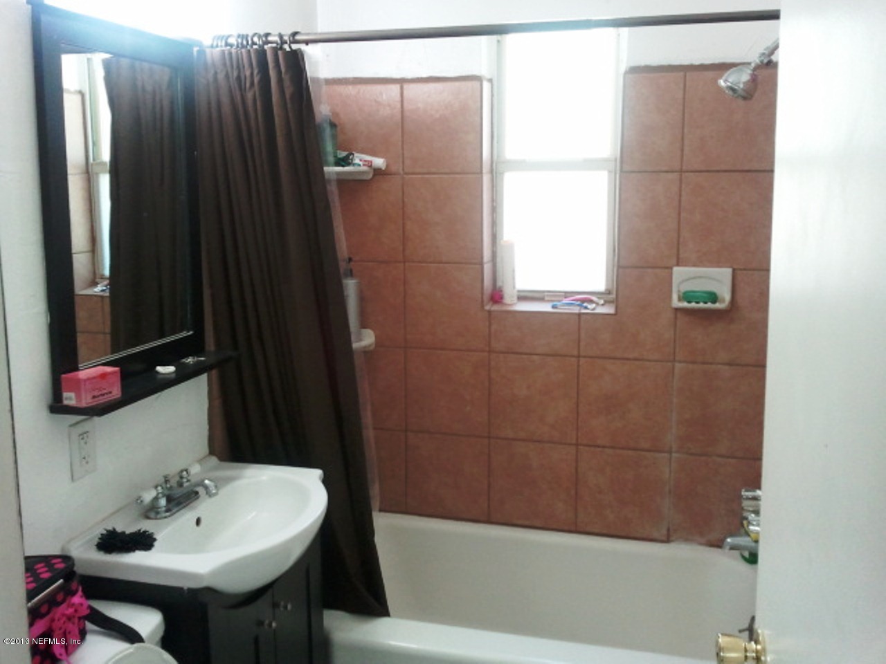 2133 Newberry Road Jacksonville, FL 32218 - Photo 12 of 29 a bathroom with a sink and a bathtub